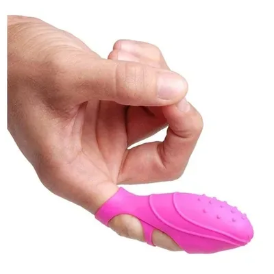 Kleiner rosafarbener Fingervibrator mit Noppen, der über die Fingerspitze gestreift wird